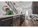 Bright modern kitchen with stainless appliances, marble counters, and hardwood floors at 1024 W 8Th Ave, Denver, CO 80204