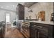 Modern kitchen has stainless steel oven, marble countertops, and wooden cabinets at 1024 W 8Th Ave, Denver, CO 80204