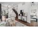 Bright and open living area showcasing hardwood floors, modern lighting, and staircase at 1024 W 8Th Ave, Denver, CO 80204