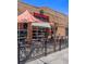 Outdoor patio with metal tables and chairs in front of Renegade brewery, inviting outdoor experience at 1024 W 8Th Ave, Denver, CO 80204