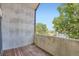Outdoor balcony space with wood flooring and views of trees, offering a serene escape at 3539 S Fairplay Way # 10, Aurora, CO 80014