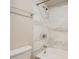 Bathroom features a shower over tub, with tile surround, and chrome fixtures at 3539 S Fairplay Way # 10, Aurora, CO 80014