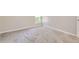 Bright bedroom features neutral walls, baseboard trim, and soft carpeting at 3539 S Fairplay Way # 10, Aurora, CO 80014