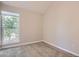 Bright bedroom with a large window providing ample natural light and a view of the outside at 3539 S Fairplay Way # 10, Aurora, CO 80014