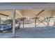 Designated carport parking area with a vehicle, offering convenient covered parking at 3539 S Fairplay Way # 10, Aurora, CO 80014