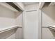 Spacious walk-in closet with white walls, ample shelving, and a closed door at 3539 S Fairplay Way # 10, Aurora, CO 80014