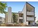 Contemporary apartment building featuring a concrete chimney and stairways to upper-level units at 3539 S Fairplay Way # 10, Aurora, CO 80014