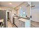 Charming kitchen featuring white cabinets, stainless steel appliances, and designer backsplash at 3539 S Fairplay Way # 10, Aurora, CO 80014