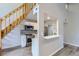 Modern kitchen with white cabinets, stainless steel appliances, and unique backsplash at 3539 S Fairplay Way # 10, Aurora, CO 80014