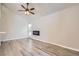 Bright living room with wood floors, high ceilings, and a modern fireplace at 3539 S Fairplay Way # 10, Aurora, CO 80014