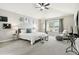 Bright main bedroom featuring plush carpet, a cozy window seat, and minimalist decor, creating a peaceful retreat at 22435 E Plymouth Cir, Aurora, CO 80016