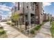 Back patio area of modern townhouse with grill and fenced in area at 5026 S Platte River Pkwy, Littleton, CO 80123
