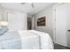 Bright bedroom with closet and interior door, offers a peaceful retreat with stylish decor at 5026 S Platte River Pkwy, Littleton, CO 80123