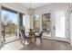 Bright breakfast nook featuring modern lighting, table with seating, and natural light at 5026 S Platte River Pkwy, Littleton, CO 80123