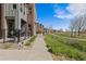 Picturesque street view with modern townhomes and beautifully landscaped walkways, and trails at 5026 S Platte River Pkwy, Littleton, CO 80123