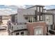 Exterior view of the community, showing a rooftop deck with an outdoor TV and other outdoor balconies at 5026 S Platte River Pkwy, Littleton, CO 80123