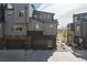 Attached garages provide convenience and security for these modern townhomes at 5026 S Platte River Pkwy, Littleton, CO 80123