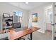 Bright home office with a modern desk, decor, and large window that provides natural light at 5026 S Platte River Pkwy, Littleton, CO 80123