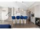 Modern kitchen with stainless steel appliances, island with seating, and sleek cabinets at 5026 S Platte River Pkwy, Littleton, CO 80123