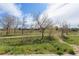 Lush greenery and walking trails provide a serene natural backdrop to the property at 5026 S Platte River Pkwy, Littleton, CO 80123