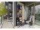 Outdoor patio area featuring cozy seating and a grill with views of the property at 5026 S Platte River Pkwy, Littleton, CO 80123