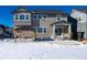 Two-story home with backyard patio, gazebo, and snowy landscape at 3101 Carabiner St, Castle Rock, CO 80108