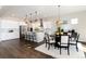 Modern kitchen with white cabinets and kitchen island at 3101 Carabiner St, Castle Rock, CO 80108