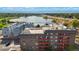 Elevated view of the complex with a highway and a lake in the background at 3047 W 47Th Ave # 607, Denver, CO 80211