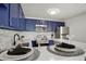 Stylish kitchen with seating and views of the sleek cabinets and countertops at 3047 W 47Th Ave # 607, Denver, CO 80211