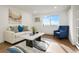 Bright living room boasts neutral paint, luxury vinyl flooring, and a large window with stunning views at 3047 W 47Th Ave # 607, Denver, CO 80211