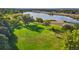 Expansive green park with mature trees and scenic lake views, perfect for recreation and relaxation at 3047 W 47Th Ave # 607, Denver, CO 80211