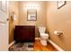 Well-lit powder bathroom with vanity, mirror, and modern fixtures at 6454 S Nelson Way, Littleton, CO 80127