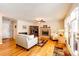 Comfortable living room with hardwood floors, fireplace, and cozy seating at 6454 S Nelson Way, Littleton, CO 80127