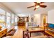 Open-concept living area with hardwood floors, access to the kitchen, and plenty of natural light at 6454 S Nelson Way, Littleton, CO 80127