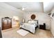 Serene main bedroom with accent wall, ceiling fan, and ensuite bathroom at 6454 S Nelson Way, Littleton, CO 80127