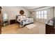 Comfortable main bedroom with decor, a soft rug, and natural lighting at 6454 S Nelson Way, Littleton, CO 80127