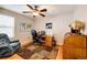 Office featuring a ceiling fan, hardwood floors, world map, and a comfortable chair at 6454 S Nelson Way, Littleton, CO 80127