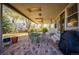 Covered patio with brick flooring, outdoor seating, a ceiling fan, and a grill, perfect for entertaining at 6454 S Nelson Way, Littleton, CO 80127