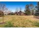 An expansive backyard space with mature trees, offering a peaceful and private setting at 7288 S Sundown Cir, Littleton, CO 80120