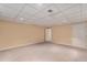 Unfurnished basement featuring neutral walls, carpet, and a drop ceiling with recessed lighting at 7288 S Sundown Cir, Littleton, CO 80120