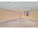 Unfurnished basement featuring carpet flooring, neutral walls, and a drop ceiling with recessed lights at 7288 S Sundown Cir, Littleton, CO 80120