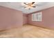 Bedroom featuring carpeted floors, ceiling fan and a window with shutters and a built-in closet at 7288 S Sundown Cir, Littleton, CO 80120