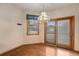 Traditional dining room features a hanging light fixture and sliding glass doors to the backyard at 7288 S Sundown Cir, Littleton, CO 80120
