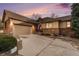 Beautiful single Gathering home with a two car garage, brick exterior and large driveway at 7288 S Sundown Cir, Littleton, CO 80120