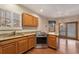 Well-appointed kitchen with stainless steel appliances and granite countertops at 7288 S Sundown Cir, Littleton, CO 80120