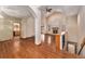 Spacious living room with high ceilings, a cozy fireplace, and abundant natural light at 7288 S Sundown Cir, Littleton, CO 80120