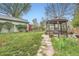 Green yard featuring a cozy gazebo and lush lawn at 4965 Dover St, Arvada, CO 80002