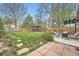 Beautifully landscaped backyard featuring a gazebo, seating area, and lush green grass at 4965 Dover St, Arvada, CO 80002