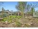 Expansive backyard with lush greenery, seating, patio, and a shed at 4965 Dover St, Arvada, CO 80002