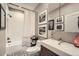 Well-designed bathroom with a bathtub and shower combo, modern vanity, and stylish black and white accents at 4965 Dover St, Arvada, CO 80002